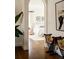 View of a bedroom with a bed and hardwood floors, seen through an archway at 5700 S Steele St, Greenwood Village, CO 80121