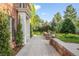Brick walkway leading to front entrance, showcasing professional landscaping and brick facade at 5700 S Steele St, Greenwood Village, CO 80121