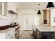 Beautiful kitchen with stainless steel appliances, white cabinets, and a marble countertop island at 5700 S Steele St, Greenwood Village, CO 80121
