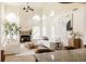 Bright living room boasting high ceilings, large windows, fireplace, and neutral decor at 5700 S Steele St, Greenwood Village, CO 80121