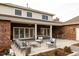 Covered patio with outdoor seating and a built-in grill at 5700 S Steele St, Greenwood Village, CO 80121