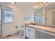 Bathroom features a modern vanity with shower and decorative lighting at 5130 S Wenatchee St, Aurora, CO 80015