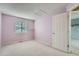 This is a bedroom with carpet, a large window, and white walls at 5130 S Wenatchee St, Aurora, CO 80015
