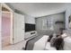 Cozy bedroom includes plush carpet, large window, and contemporary accents at 5130 S Wenatchee St, Aurora, CO 80015