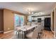 Bright dining area adjacent to the kitchen featuring a marble table and access to the backyard at 5130 S Wenatchee St, Aurora, CO 80015