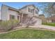 Charming two-story home with well-maintained lawn, mature trees, and a welcoming front entrance at 5130 S Wenatchee St, Aurora, CO 80015