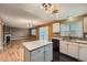 Open kitchen boasts stainless appliances, granite countertops, eat-in space, and natural light at 5130 S Wenatchee St, Aurora, CO 80015