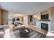 Open concept living space with a combined kitchen and living room with an abundance of natural light at 5130 S Wenatchee St, Aurora, CO 80015