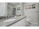 Modern bathroom with double vanity and shower at 28418 E 8Th Pl, Watkins, CO 80137