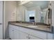 Double vanity bathroom with gray countertops and a large mirror at 28418 E 8Th Pl, Watkins, CO 80137