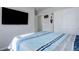 Spacious bedroom with mounted TV and closet at 28418 E 8Th Pl, Watkins, CO 80137