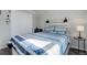 Cozy bedroom featuring a double bed and sliding door closet at 28418 E 8Th Pl, Watkins, CO 80137