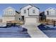 Two-story townhome with attached garage and small fenced yard at 28418 E 8Th Pl, Watkins, CO 80137