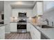 Modern kitchen with stainless steel appliances and gray countertops at 28418 E 8Th Pl, Watkins, CO 80137