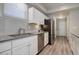 Modern kitchen with stainless steel appliances and gray countertops at 28418 E 8Th Pl, Watkins, CO 80137