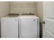 Bright laundry room with washer and dryer included at 28418 E 8Th Pl, Watkins, CO 80137