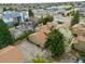 View of property shows mature trees, garages, and nearby streets and parking at 1080 S Yampa St, Aurora, CO 80017