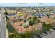 Aerial view showcases community, HOA pool, Downtown Denver, and UC Anschutz Medical Campus at 1080 S Yampa St, Aurora, CO 80017