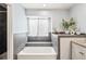 This bathroom features neutral tile and a step-up soaking tub at 1080 S Yampa St, Aurora, CO 80017