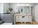 Bathroom with double sinks with granite countertops and a bathtub, decorated with plants at 1080 S Yampa St, Aurora, CO 80017