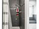 This shower boasts neutral tile and a convenient storage rack at 1080 S Yampa St, Aurora, CO 80017