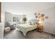 Serene bedroom with window seat, neutral decor, and woven wall art at 1080 S Yampa St, Aurora, CO 80017