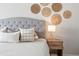 Relaxing bedroom featuring a tufted headboard and natural textures at 1080 S Yampa St, Aurora, CO 80017