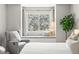 Cozy window seat in the bedroom with a soothing view of trees in bloom at 1080 S Yampa St, Aurora, CO 80017