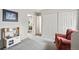 Spacious bedroom with neutral carpet, play area, and direct access to more rooms at 1080 S Yampa St, Aurora, CO 80017