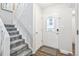 This entryway offers a staircase to the second level and an exterior door at 1080 S Yampa St, Aurora, CO 80017