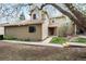 Charming two-story home with a blossoming tree in the front yard at 1080 S Yampa St, Aurora, CO 80017