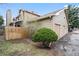 View of the home's exterior, fenced yard, and detached two car garage at 1080 S Yampa St, Aurora, CO 80017