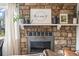 Cozy stone fireplace featuring a decorative mantel and hearth at 1080 S Yampa St, Aurora, CO 80017