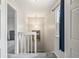 This hallway features a stairway and access to bedrooms at 1080 S Yampa St, Aurora, CO 80017