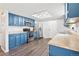 Well-equipped kitchen with modern appliances, light countertops, and beautiful light-colored flooring at 1080 S Yampa St, Aurora, CO 80017