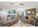 Spacious open-plan living room featuring neutral colors, access to kitchen, and access to the dining area at 1080 S Yampa St, Aurora, CO 80017