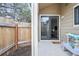 Private patio with fenced yard accessible through a sliding glass door at 1080 S Yampa St, Aurora, CO 80017