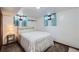 Bedroom featuring carpeted floors, white walls, and a comfy looking bed at 1328 S Zuni St, Denver, CO 80223