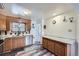 Functional kitchen with stainless steel dishwasher and sink, wood cabinets, and modern countertops at 1328 S Zuni St, Denver, CO 80223