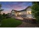 Backyard with fire pit, lounge chairs, and well maintained lawn at 14303 Glenayre Cir, Parker, CO 80134