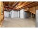 Unfinished basement space, featuring exposed wood beams, concrete floor, and insulation, ready for customization at 14303 Glenayre Cir, Parker, CO 80134