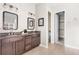 Bathroom featuring a double vanity with dark wood cabinets at 14303 Glenayre Cir, Parker, CO 80134