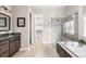 Bathroom with soaking tub, glass shower and walk-in closet at 14303 Glenayre Cir, Parker, CO 80134