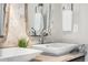 Bathroom featuring dual sinks, granite countertops and decorative mirrors at 14303 Glenayre Cir, Parker, CO 80134