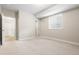 Neutral bedroom with large window and adjoining room at 14303 Glenayre Cir, Parker, CO 80134