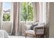 Bedroom seating area near a window with a lush green view at 14303 Glenayre Cir, Parker, CO 80134