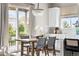 Bright dining area featuring hardwood floors, chandelier, and sliding doors to the deck at 14303 Glenayre Cir, Parker, CO 80134