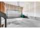 Clean, two car garage with sealed concrete floor, storage shelves, and automatic door opener system installed at 14303 Glenayre Cir, Parker, CO 80134