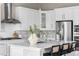 A stylish kitchen with stainless steel appliances and white cabinets at 14303 Glenayre Cir, Parker, CO 80134