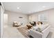 Cozy living room featuring a sofa, chairs, accent rug and light-colored walls, creating an inviting gathering space at 14303 Glenayre Cir, Parker, CO 80134